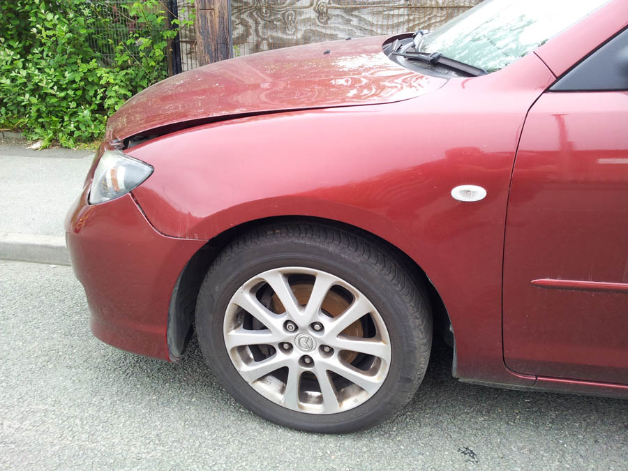 Mazda 3 Takara wing-passenger-side-front